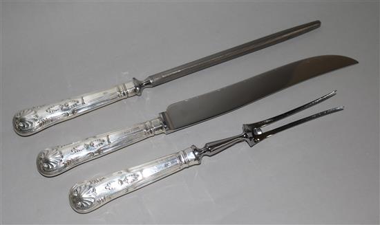 A three piece silver handled Kings pattern carving set.
